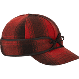 The Original Stormy Kromer Cap: a wool, six-panel winter cap with a pulldown earband, brim and tie in the front.