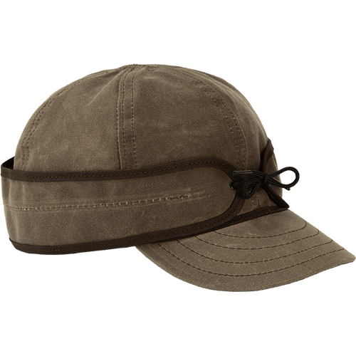 Image of Stormy Kromer Insulated Waxed Cotton Cap: a six-panel waxed cotton cool weather cap with a pulldown earband and a tie in the front.