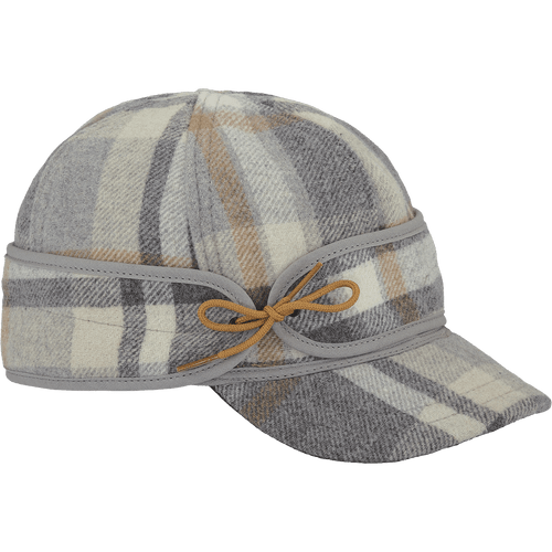 A 45 degree angle view of The Sidekick Cap: a wool, six-panel winter cap with a pulldown earband that ties off to the side, and a brim.