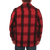 On model, back view of the Mackinaw Coat: A collared, button-front wool coat with six large pockets on the front. The model has their hands in the side pockets.