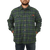 On model front view of the Camp Shirt Jack: A lined, plaid flannel overshirt with snap front, two chest pockets with snap closure and two side pockets. Model has hands in pockets.