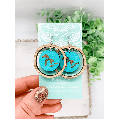 Pair of round earrings with a turquoise round with the Great Lakes surrounded by a light wood, round dangling frame