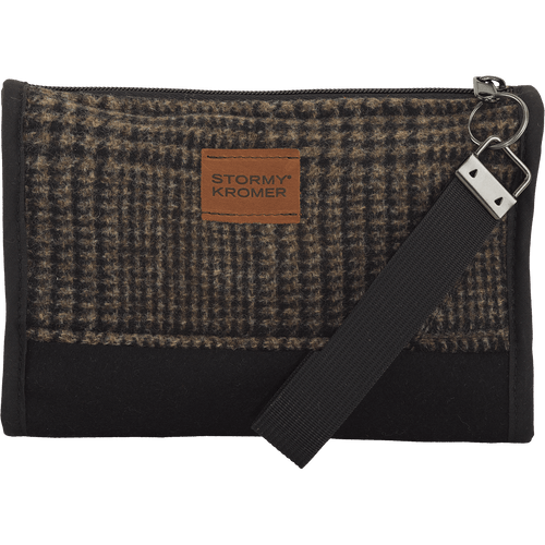 Front view of the Main Street Clutch: A small, zip top clutch with a wrist strap attached to the zipper. The upper is a plaid wool, the bottom, trim and strap are solid. It has a leather Stormy Kromer logo patch on the front.